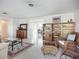 Inviting living room featuring hardwood floors, bookshelves, and a comfortable seating area at 2108 Lee Ln, Sarasota, FL 34231