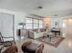Cozy living area with terrazzo floors, a large window, and comfortable seating at 2108 Lee Ln, Sarasota, FL 34231