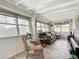 Inviting sunroom with multiple windows, comfortable seating, and stylish decor, perfect for relaxation and enjoying natural light at 2108 Lee Ln, Sarasota, FL 34231