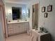 Bathroom with a vanity, mirror, lighting and a separate area for the toilet and shower at 22 Nautical Dr, North Port, FL 34287