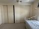 Bedroom featuring a daybed, ceiling fan, and a closet with sliding doors at 22 Nautical Dr, North Port, FL 34287