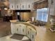 Efficient kitchen featuring a curved counter, laminate countertops, and ample cabinet space at 22 Nautical Dr, North Port, FL 34287