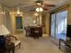 Cozy living area with a wet bar, neutral carpet, and sliding glass doors to the lanai at 22 Nautical Dr, North Port, FL 34287