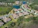 Aerial view showcases the community's houses, ponds, and mature trees at 220 Sarezzo Cir, Nokomis, FL 34275