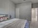 The bedroom features soft carpet, accent walls, and leads to the ensuite bathroom at 220 Sarezzo Cir, Nokomis, FL 34275