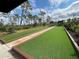 Outdoor bocce ball courts with manicured turf and shady shelters at 220 Sarezzo Cir, Nokomis, FL 34275