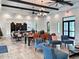 Spacious clubhouse area with modern furniture and ample seating for gatherings at 220 Sarezzo Cir, Nokomis, FL 34275