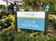 Attractive Club Vicenza sign framed by lush foliage providing a sense of community at 220 Sarezzo Cir, Nokomis, FL 34275