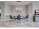 Dining room featuring a glass table, chandelier and decorative mirror at 220 Sarezzo Cir, Nokomis, FL 34275