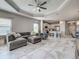Spacious open-concept living room with a modern kitchen and dining area at 220 Sarezzo Cir, Nokomis, FL 34275
