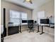 Dedicated office space with ample natural light and modern workstations for productive work at 220 Sarezzo Cir, Nokomis, FL 34275