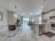 Bright open-concept area combines dining, kitchen and living spaces for modern living and entertaining at 220 Sarezzo Cir, Nokomis, FL 34275
