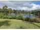 Outdoor pickleball courts with lush landscaping and a secure fence at 220 Sarezzo Cir, Nokomis, FL 34275