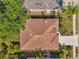 Aerial view of the home showcasing its roof and proximity to neighboring houses and landscaping at 2318 Harrier Way, Nokomis, FL 34275