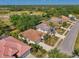 Aerial view of homes in a lush green neighborhood at 2318 Harrier Way, Nokomis, FL 34275