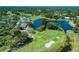 Beautiful aerial view of the golf course, sand trap, green, lakes, and surrounding community at 2318 Harrier Way, Nokomis, FL 34275
