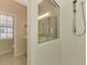 Modern bathroom with a view of the vanity and a fully tiled walk-in shower at 2318 Harrier Way, Nokomis, FL 34275