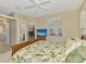 Bright bedroom with views through a window and a glimpse into other rooms at 2318 Harrier Way, Nokomis, FL 34275