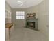 Cozy bedroom showcasing a classic fireplace and neutral decor at 2318 Harrier Way, Nokomis, FL 34275