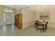 Dining room boasts ample natural light and elegant lighting fixtures at 2318 Harrier Way, Nokomis, FL 34275