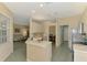 Open-concept kitchen connects seamlessly to the living and dining areas, perfect for entertaining guests at 2318 Harrier Way, Nokomis, FL 34275