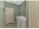 Well-equipped laundry room with modern appliances and functional storage solutions at 2318 Harrier Way, Nokomis, FL 34275