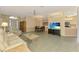 Open living room showcases a dining area, comfortable seating, and flows into the kitchen at 2318 Harrier Way, Nokomis, FL 34275