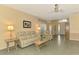 Comfortable living room with neutral walls and tile flooring, perfect for relaxation at 2318 Harrier Way, Nokomis, FL 34275