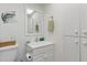 Bright bathroom featuring white vanity, decorative elements and storage at 244 Saint Augustine # 605, Venice, FL 34285