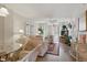 Cozy living room with elegant furnishings and sliding glass doors to an outdoor patio at 244 Saint Augustine # 605, Venice, FL 34285
