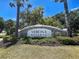Elegant entrance to Verona Reserve with lush landscaping, welcoming residents and guests at 275 Capulet Dr, Venice, FL 34292