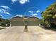 Charming townhome featuring attached garages, lovely landscaping, and well-manicured lawns at 275 Capulet Dr, Venice, FL 34292