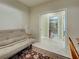 Flex room with desk, futon, decorative rug, and doorways to a bathroom and another room at 275 Capulet Dr, Venice, FL 34292