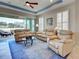 The living room features an airy atmosphere, with an easy transition to the screened lanai at 275 Capulet Dr, Venice, FL 34292