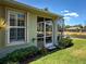 This home has a screened patio with a view of the lush landscaping and pond at 275 Capulet Dr, Venice, FL 34292