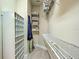 Walk-in closet features custom shelving, providing ample storage space at 275 Capulet Dr, Venice, FL 34292