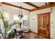 Cozy breakfast nook with built-in seating, natural light and wooden door at 2750 Gocio Road Ext, Sarasota, FL 34235