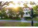 Gorgeous home with lush landscaping and a stone pathway at 2750 Gocio Road Ext, Sarasota, FL 34235