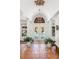 Elegant foyer featuring white columns, tile floors, and French doors leading to the pool at 2750 Gocio Road Ext, Sarasota, FL 34235