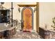 Intricate wood front door with stone accents at 2750 Gocio Road Ext, Sarasota, FL 34235