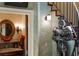 Hallway featuring decorative accents, tile flooring and a nearby bathroom at 2750 Gocio Road Ext, Sarasota, FL 34235