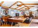 Nautical themed living room featuring custom boat bar, pool table, wood beams and hardwood floors at 2750 Gocio Road Ext, Sarasota, FL 34235