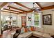Comfortable living room featuring wood beams, natural light and stylish decor at 2750 Gocio Road Ext, Sarasota, FL 34235