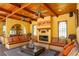 Inviting living room with fireplace, custom wood ceiling, and stylish decor at 2750 Gocio Road Ext, Sarasota, FL 34235