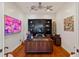 Office space with hardwood floors, ceiling fans, custom artwork and a large desk at 2750 Gocio Road Ext, Sarasota, FL 34235