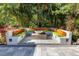 Secluded outdoor seating area with built in benches, perfect for relaxing and enjoying the landscape at 2750 Gocio Road Ext, Sarasota, FL 34235