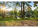 Picturesque view of the pond from the yard, highlighting the natural beauty of the property at 2750 Gocio Road Ext, Sarasota, FL 34235