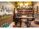 Wine cellar featuring custom shelving, custom lighting, hardwood floors and wine selections at 2750 Gocio Road Ext, Sarasota, FL 34235