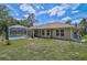 Spacious backyard showcasing the screened-in pool, patio, and the well-maintained lawn at 2834 Coolidge Ave, North Port, FL 34286