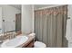 Bathroom featuring a vanity, sink, toilet, and shower with curtain at 2834 Coolidge Ave, North Port, FL 34286